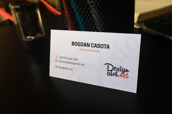 business-card-mockup-laying-against-pen-holder