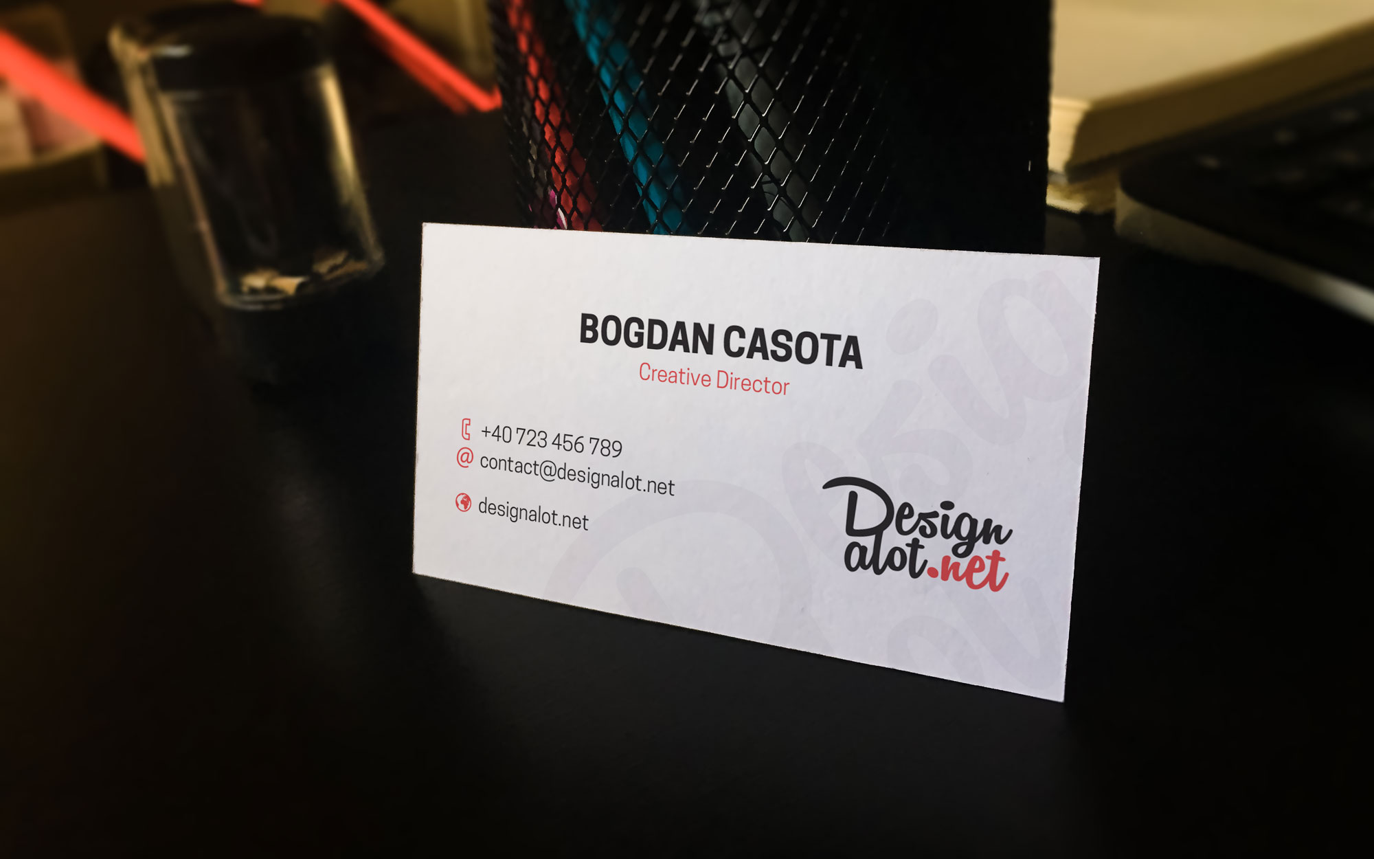 business-card-mockup-laying-against-pen-holder