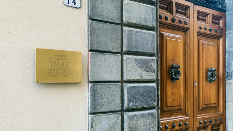 Professional services logo mockups on a golden entrance plaque